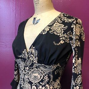 Stretch knit black dress with floral lace print